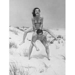  Young Couple on Beach, Woman Leap Frogging Man, Portrait 