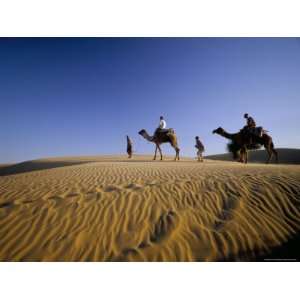  Caravan of People and Camels in the Thar Desert, Rajasthan 
