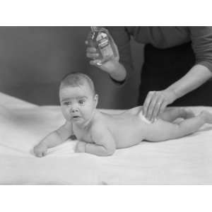  Mother Applying Lotion to Babys Buttocks Photographic 