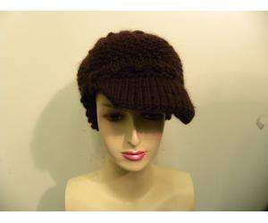 PATRICIA UNDERWOOD brown knit hat.Has small front rim and lots of 