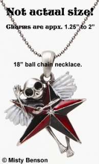 mischievous little skelly hanging on a red and black nautical star