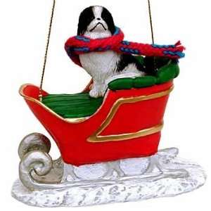 Japanese Chin in a Sleigh Christmas Ornament