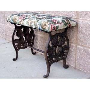  CAST IRON UPHOLSTERED ANGEL BENCH