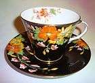 handpainted florals on black aynsley tea cup and saucer returns